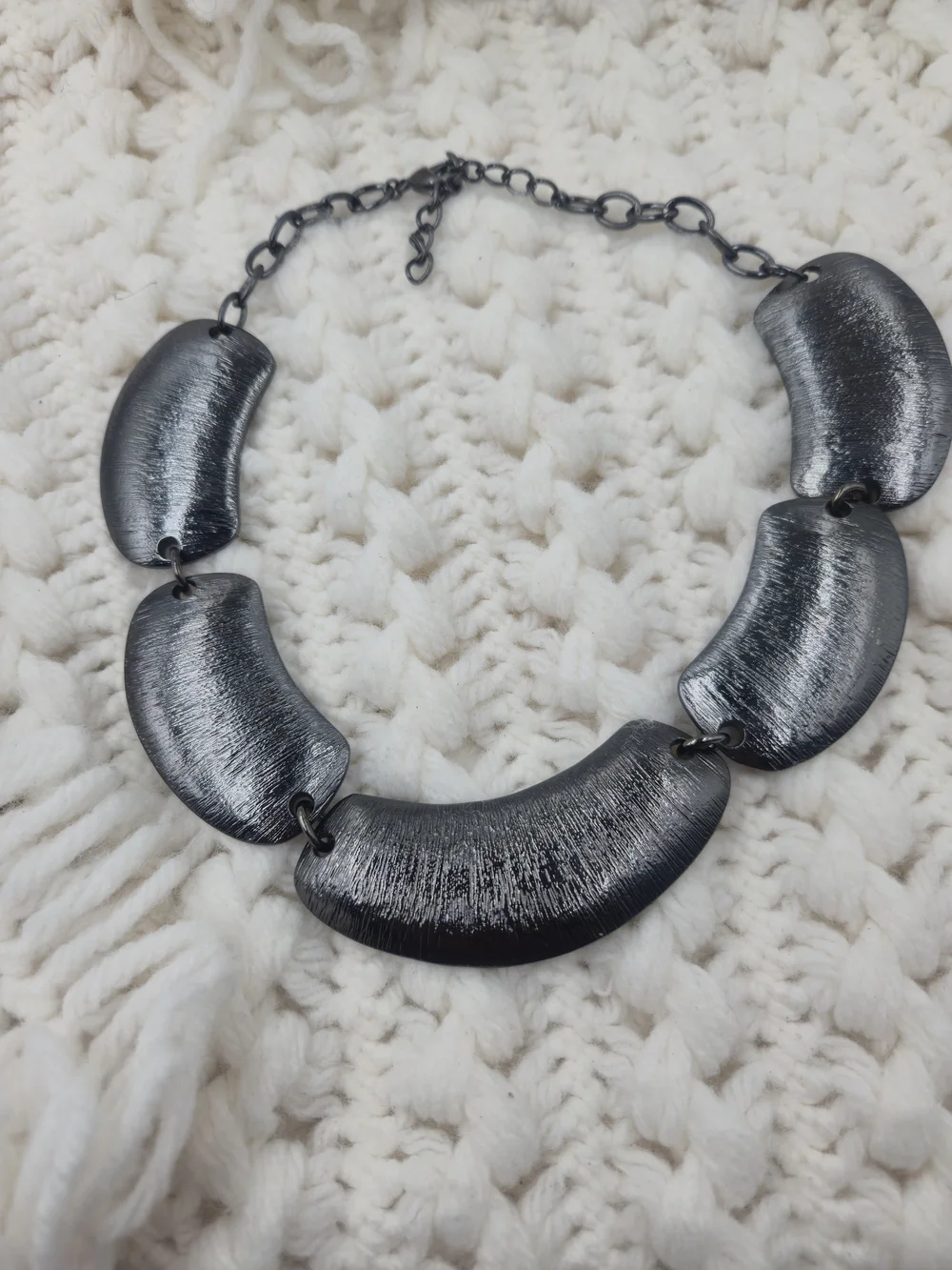 Heidi Klum silver tone textured necklace featuring brushed metal links.